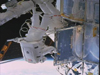 Astronauts perform space walk to service the Hubble