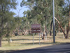 Road sign advertising the camel farm and date farm, just outside the town. Camels are used to ride tourists around the Todd River.