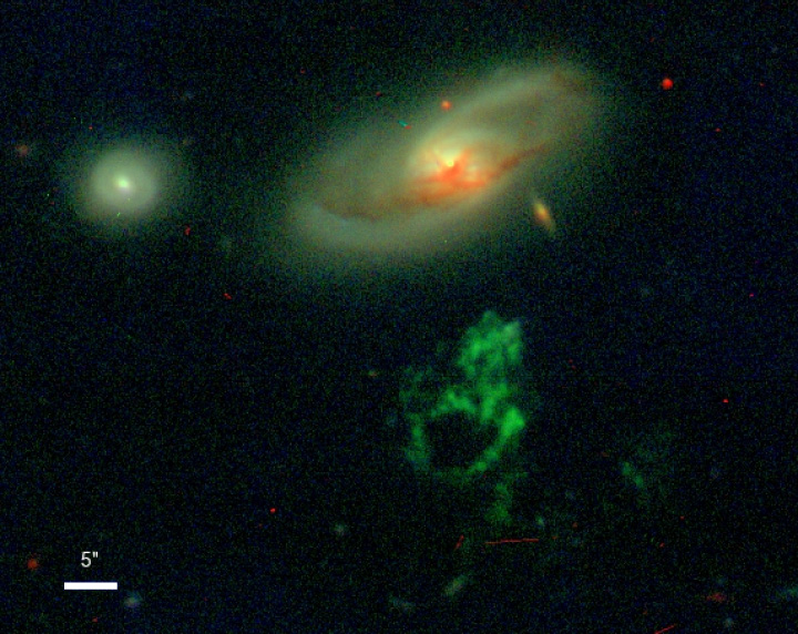 Ground-based optical image of IC 2497 (top), Hanny’s Voorwerp (bottom), and a nearby companion galaxy (left). This image is a composite of blue, visual, and near infrared light images taken with the WIYN telescope. Credit: WIYN/William Keel/Anna Manning