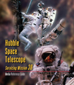 Cover of the SM3B media guide showing three astronauts working onthe Hubble
