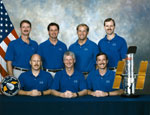 Crew STS-82 (left to right): (seated) Kenneth D. Bowersox, Steven A. Hawley, Scott J. Horowitz, (standing) Joseph R. Tanner, Gregory J. Harbaugh, Mark C. Lee, Steven L. Smith