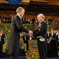 Dr. John C. Mather at the Nobel Award ceremony, accepting his award from the King of Sweden.