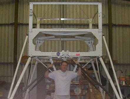 Scott standing in front of the NIGHTGLOW instrument