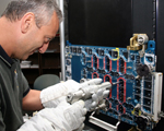 Astronaut Mike Massimino practices STIS repair using the MPT and FCP