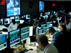 Technicians and engineers practice servicing mission procedures in the Space Telescope Operations Control Center (STOCC) at Goddard