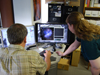 Zolt Levay (left) and Vanessa Thomas review data retrieved from the Hubble Space Telescope Archive