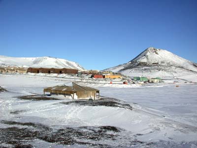 Scott's Hut with McMurdo Station behind it