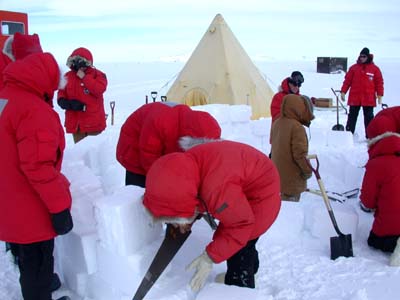 Happy Camper Team making a snow wall