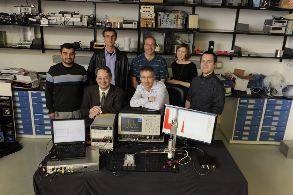 Technologists at NASA's Goddard Space Flight Center in Greenbelt, Md., created what they believe is the world's first "pulsar-on-a-table," a laboratory system shown here for testing emerging X-ray navigation technologies. Back row, left to right: Monther Hasouneh, John Gaebler, Harry Stello, Jennifer Valdez and Sam Price. Front row, left to right: Jason Mitchell and Luke Winternitz. Credits: NASA/ Pat Izzo