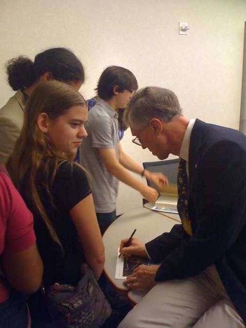 John Mather signing autographs